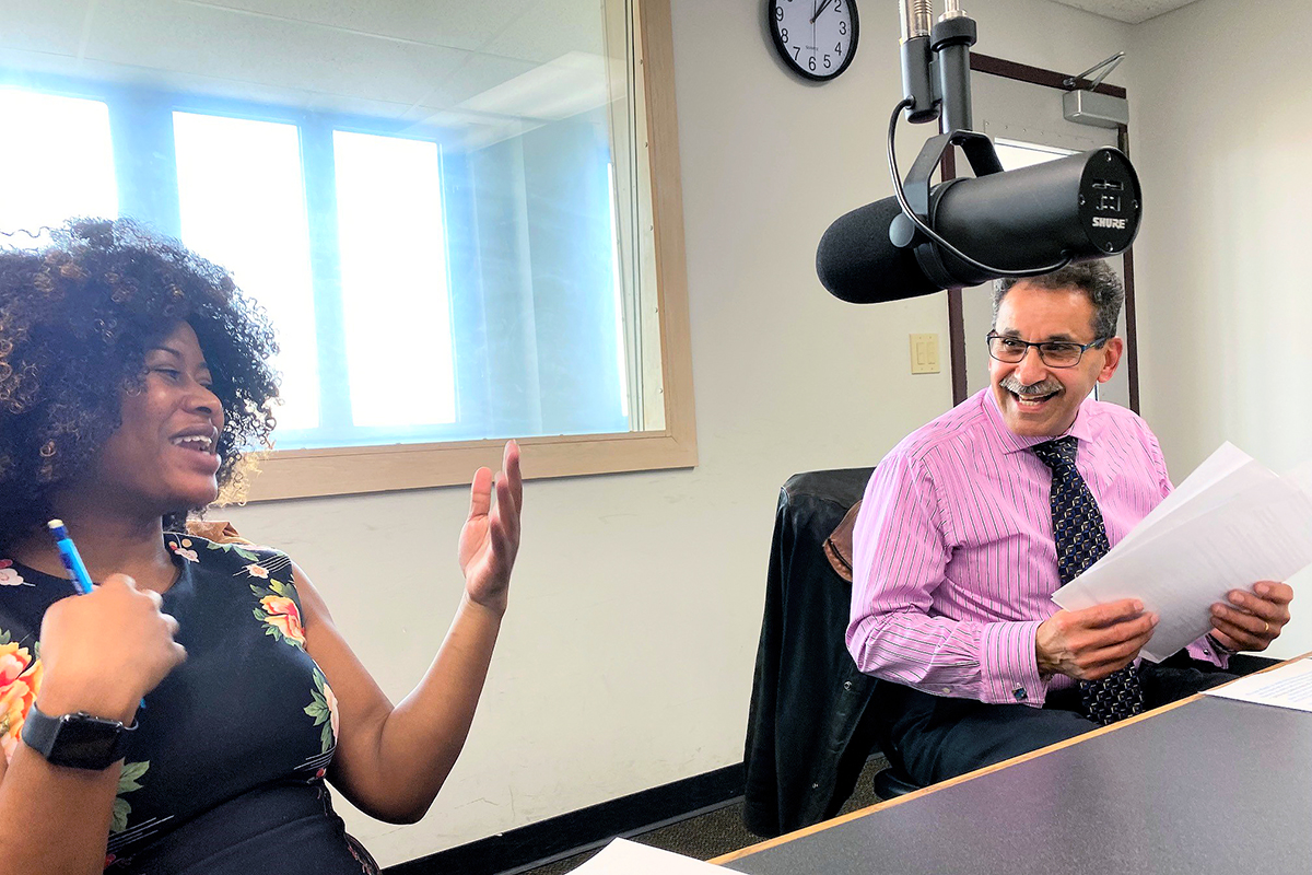 Host EbaNee Bond with electrical engineering professor Dr. J. Alexis De Abreu-Garcia in WZIP studios.