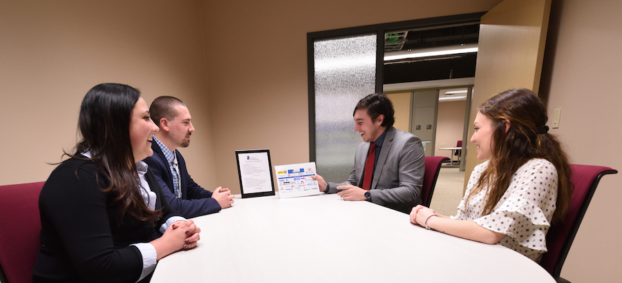 Students prepare for a “Final Role Play,” in which they will try to sell their product to a Fisher Corporate Partner