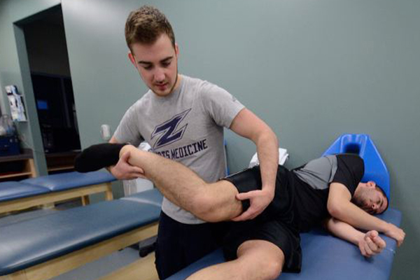 Sports science major examining a bone joint